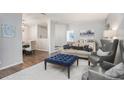 Bright living room featuring hardwood floors, modern furnishings, and neutral paint at 5245 Chemin De Vie, Atlanta, GA 30342