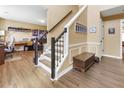 Inviting entryway with wood floors, staircase, and decorative trim, leading to the living spaces at 3798 Kirkwood Nw Run, Kennesaw, GA 30144