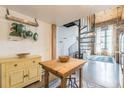 Open kitchen area with a wood table, spiral staircase, and decor at 170 Boulevard Se # 521H, Atlanta, GA 30312