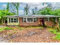 Exterior of home with brick facade, ready for renovation and landscaping to enhance curb appeal at 2322 Paces Ferry Se Rd, Smyrna, GA 30080