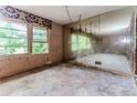 Unfinished living room showcasing natural light with potential for renovation and customization at 2322 Paces Ferry Se Rd, Smyrna, GA 30080