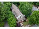 Aerial view of a home with lush, mature trees and a well-maintained yard at 380 Kendrick Se Ave, Atlanta, GA 30315