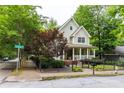 Charming home with a welcoming porch, manicured landscaping, and a wrought iron fence at 380 Kendrick Se Ave, Atlanta, GA 30315