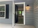A view of the house through the open front door, with an inviting glimpse of the interior at 486 Victoria Rd, Woodstock, GA 30189