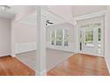 Bright living room with hardwood floors, neutral walls, and natural light at 1125 Harvest Brook Way, Lawrenceville, GA 30043