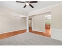 Spacious living room featuring hardwood floors, soft carpet, and bright, neutral colors at 1125 Harvest Brook Way, Lawrenceville, GA 30043