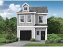 Exterior rendering of a new modern two-story home with gray siding and a black garage door at 29 Benscot Dr, Austell, GA 30106