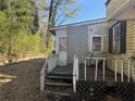 Back view of home shows back porch, yard and condition needing repair at 2284 Beecher Sw Cir, Atlanta, GA 30311