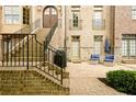 Inviting outdoor brick patio with a seating area and beautifully landscaped surroundings at 538 Micayne Cir # 3, Smyrna, GA 30082