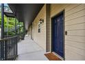 Apartment exterior featuring a walkway with black metal railings and a blue door with the number 8 at 1635 Briarcliff Rd # 8, Atlanta, GA 30306