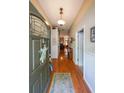 Inviting entryway with hardwood floors, neutral paint, and decorative accents that create a warm and welcoming atmosphere at 4872 Nature Trl, Austell, GA 30106
