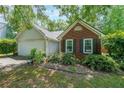 Charming home features manicured landscaping and a combination of brick and siding, creating an inviting curb appeal at 4872 Nature Trl, Austell, GA 30106