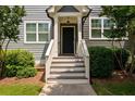 Inviting townhouse entryway showcasing stairs and a classic door design, enhancing curb appeal at 1381 Wallace Walk, Atlanta, GA 30316