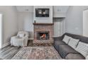 Inviting living room features a fireplace, plush seating, and warm, neutral tones at 2700 Sam Nelson Rd, Canton, GA 30114