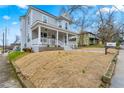 Charming two-story home with inviting front porch and well-maintained lawn at 852 Washington Sw St, Atlanta, GA 30315