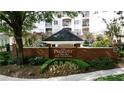 Well-maintained entrance to The Prescott at Park Place luxury condominiums with lush landscaping at 11 Perimeter E Ctr # 1203, Dunwoody, GA 30346