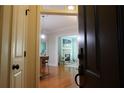 Open entryway providing a view of the living room and kitchen with hardwood flooring at 11 Perimeter E Ctr # 1203, Dunwoody, GA 30346