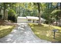 Lovely single-story home featuring an attached garage and inviting curb appeal at 520 Cranberry Pl, Roswell, GA 30076