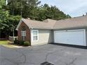Well-kept house with an attached two-car garage and manicured shrubbery at 3024 Orchard Ridge Cir, Duluth, GA 30096