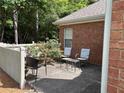 Private outdoor patio featuring comfortable seating and lush greenery at 3024 Orchard Ridge Cir, Duluth, GA 30096