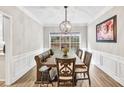 Dining room with window view and decorative lighting at 1500 Highland Farm Dr, Suwanee, GA 30024