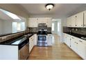 Well-equipped kitchen with stainless steel appliances, granite countertops, and ample cabinet space at 1575 Wynfield Dr, Auburn, GA 30011