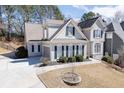 Charming two-story home featuring a neutral facade, lush landscaping, and a well-maintained front yard at 1739 Praters Pt, Dacula, GA 30019