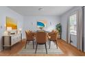 Elegant dining room with modern furnishings, hardwood floors, and ample natural light at 2655 Hayden Dr, East Point, GA 30344