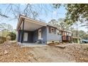 Cozy home with covered carport and inviting entry at 2608 Barge Sw Rd, Atlanta, GA 30331