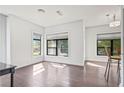 Open-concept space featuring lots of natural light and sleek hardwood flooring at 22 Moda Ln, Atlanta, GA 30316