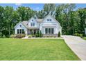 Charming two-story white home with a well-maintained lawn and landscaping at 2861 Digna Ct, Acworth, GA 30101