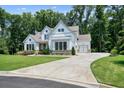 Charming two-story home with a well-manicured lawn, long driveway and an attached two-car garage at 2861 Digna Ct, Acworth, GA 30101