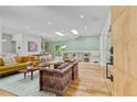Bright living room featuring hardwood floors, stylish furnishings, and built-in shelving at 1377 Oak Grove Dr, Decatur, GA 30033