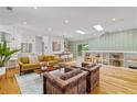 Bright living room featuring hardwood floors, stylish furnishings, and built-in shelving at 1377 Oak Grove Dr, Decatur, GA 30033