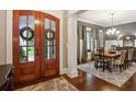 Elegant dining room featuring hardwood floors and a view of the home's entrance at 194 Locust Nw St, Marietta, GA 30064