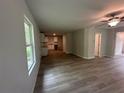 Open concept living room and kitchen space featuring modern flooring at 20 Emerald Ln, Covington, GA 30014