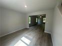 Inviting living room featuring wood-look flooring and ample natural light at 20 Emerald Ln, Covington, GA 30014