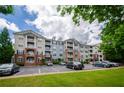 Exterior view of apartment building with parking at 1955 Nocturne Dr # 3206, Alpharetta, GA 30009
