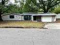 Street view showing the home's gray exterior and driveway at 2135 Wells Se Dr, Smyrna, GA 30080