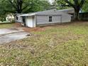 Angled exterior of the gray home showing a driveway and yard at 2135 Wells Se Dr, Smyrna, GA 30080
