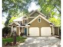 Two-story home with a two-car garage, a manicured lawn and a beautiful teal front door at 2735 Royal Blf, Decatur, GA 30030