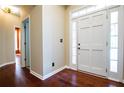 Welcoming entryway with hardwood floors and a bright, white front door at 3082 Monarch Pine Dr, Peachtree Corners, GA 30071