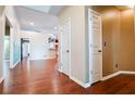 Spacious hallway with beautiful wood floors and neutral walls leading to other rooms at 3082 Monarch Pine Dr, Peachtree Corners, GA 30071