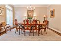 Formal dining area showcasing a decorative area rug, and a large window at 4476 Paces Battle Nw, Atlanta, GA 30327
