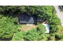 Aerial view of home surrounded by lush trees at 147 Harris Loop, Dallas, GA 30157