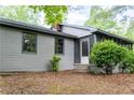 Home exterior showcasing a screened-in porch at 147 Harris Loop, Dallas, GA 30157