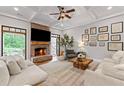 Cozy living room with a brick fireplace and access to an outdoor balcony at 18 Starlight Dr, Cartersville, GA 30121