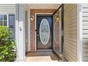 Inviting front door with decorative glass and brick accents, enhancing the entrance at 109 Riley Way, Canton, GA 30115