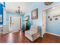 Bright entryway featuring a charming chandelier and comfortable seating area at 1162 Apalachee Run Trl, Dacula, GA 30019