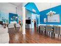 Spacious living and dining area featuring hardwood floors and vibrant blue walls at 1162 Apalachee Run Trl, Dacula, GA 30019